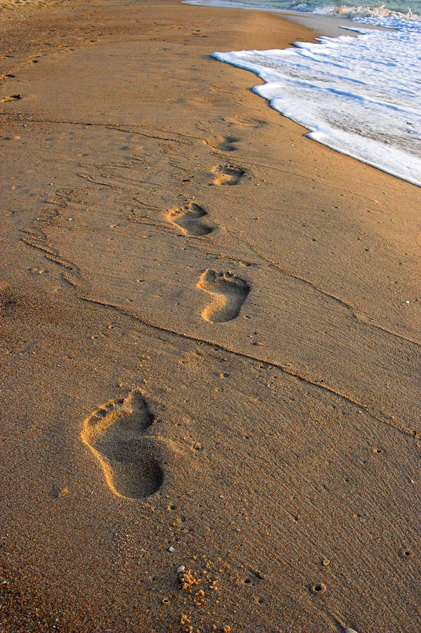 bigstock-Footprints-In-The-Sand-1502144