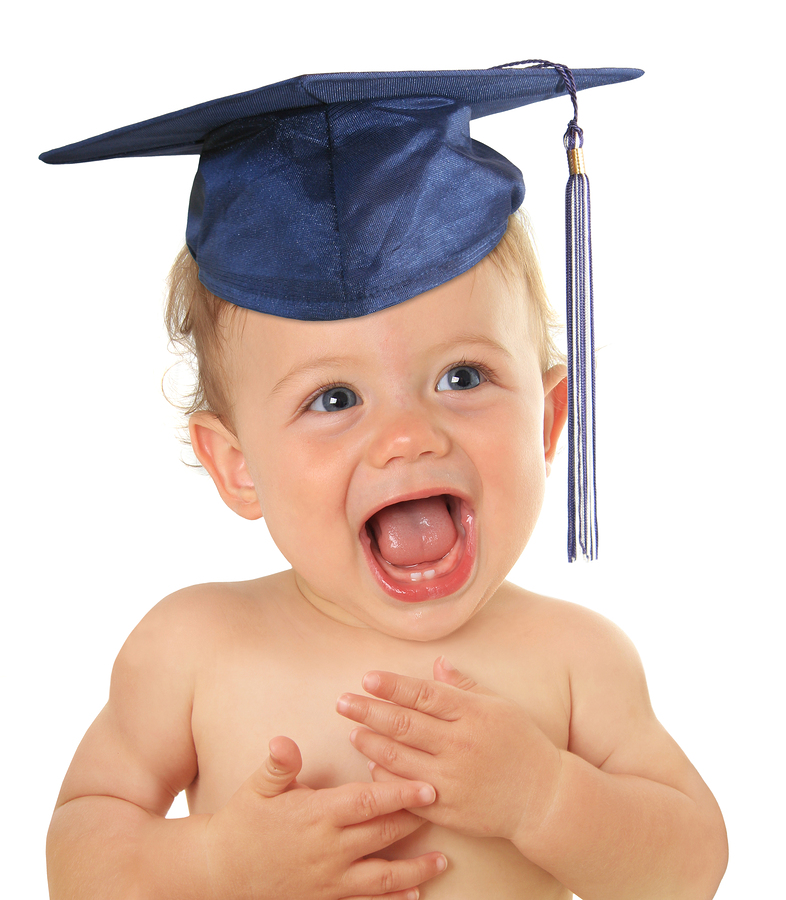 Adorable ten month old baby wearing a graduation mortar board.